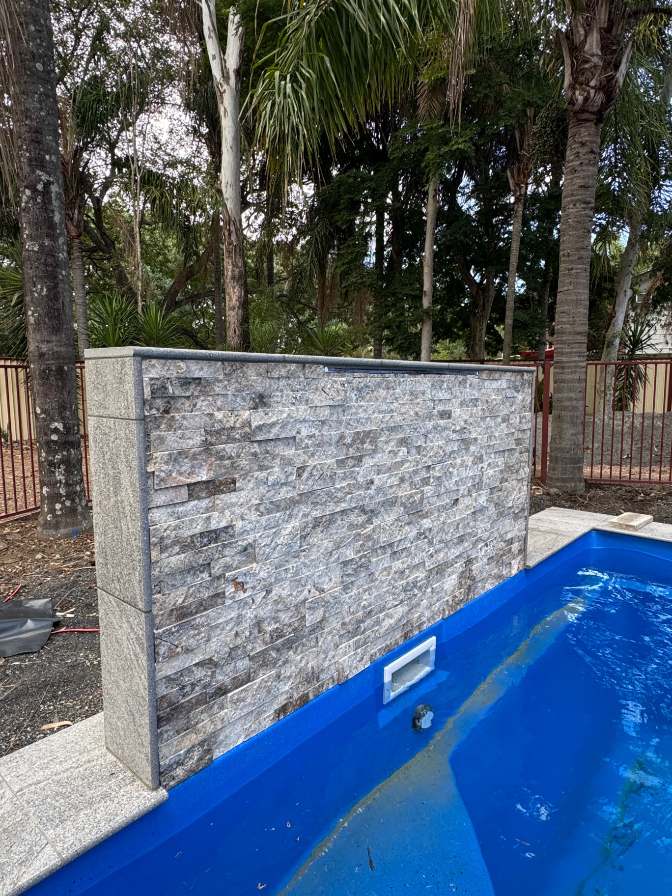 Stacked stone feature wall — Brisbane