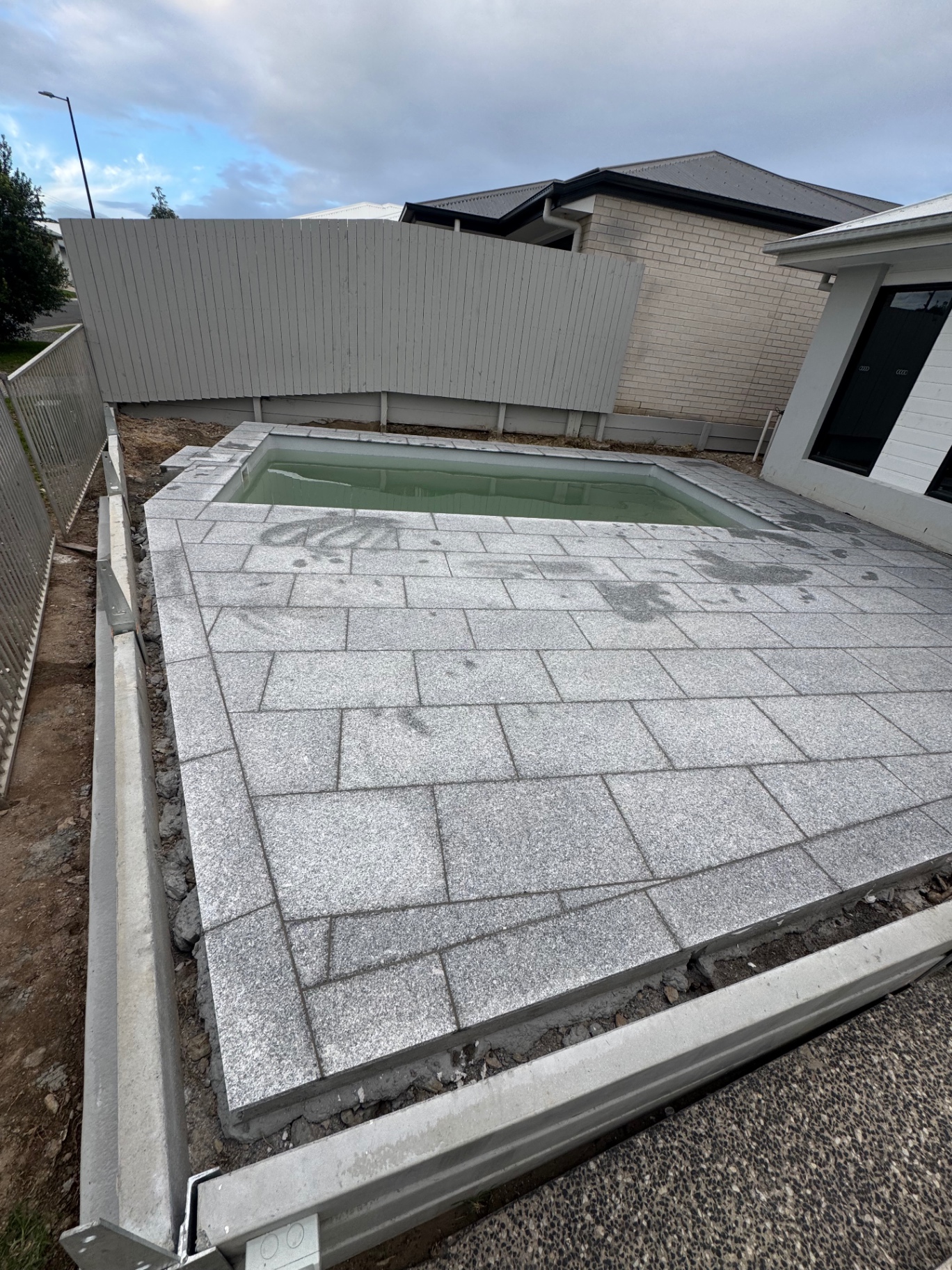 Granite tile pool surround — Brisbane