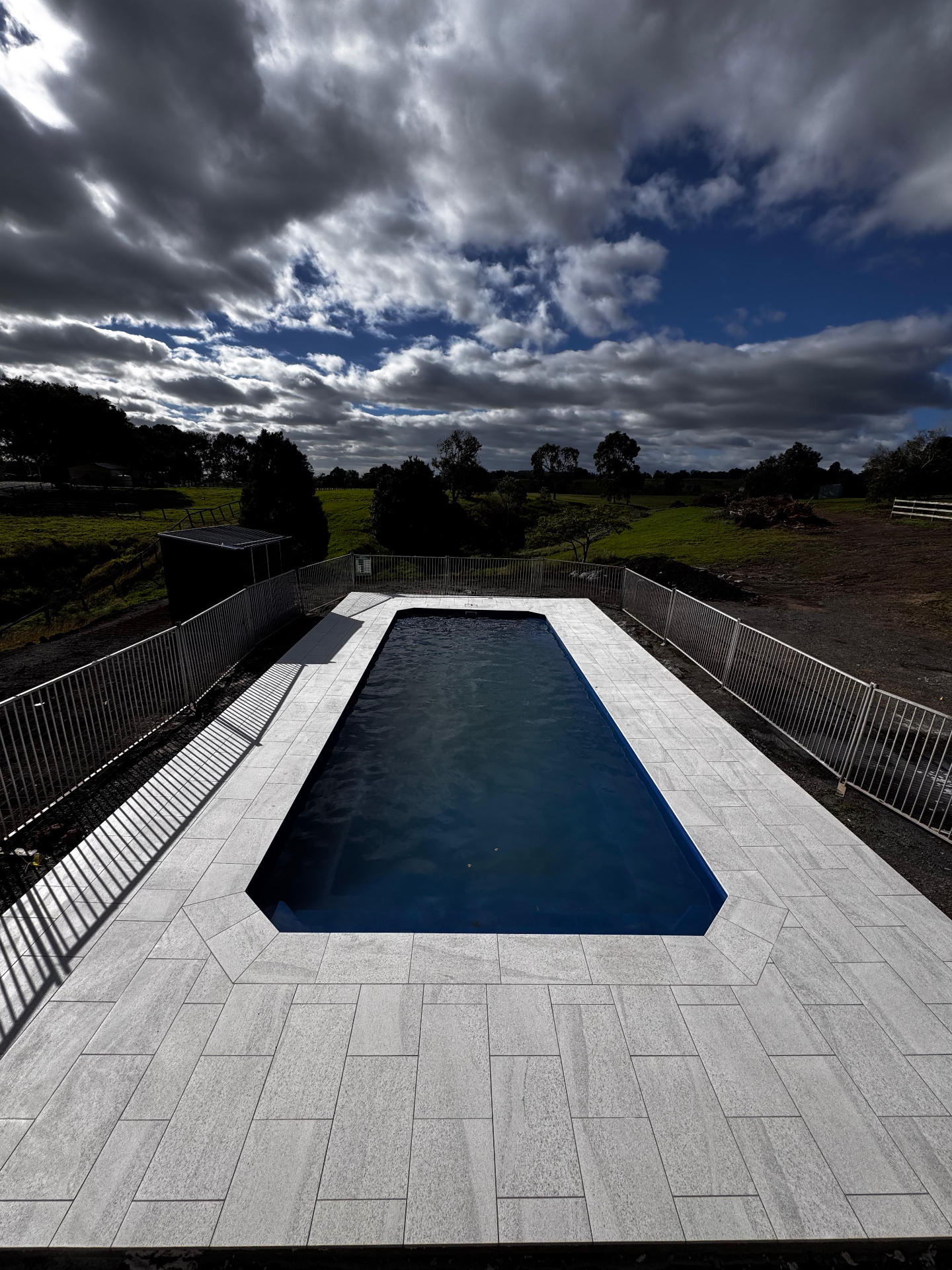 Granite paver pool surround — Brisbane